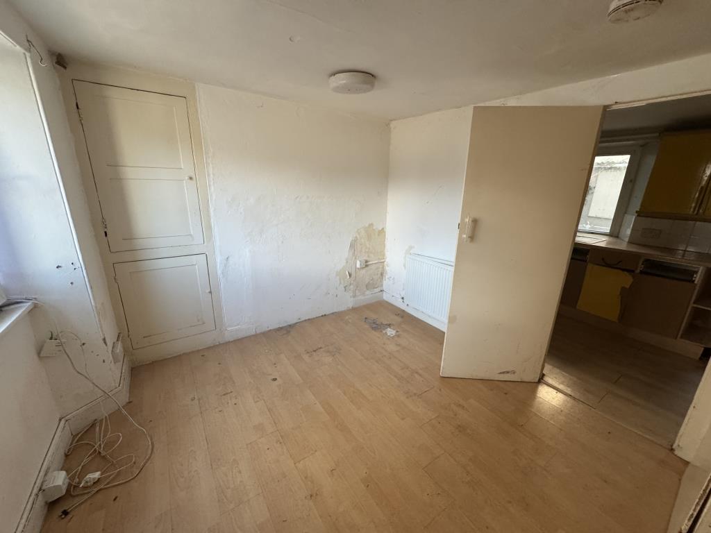 Lot: 130 - TWO-BEDROOM COTTAGE FOR IMPROVEMENT - Living room